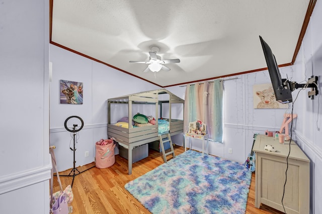 579 Fraley Rd, Salt Lick, KY 40371 - bedroom with wood finished floors, a textured ceiling, ceiling fan, and crown molding