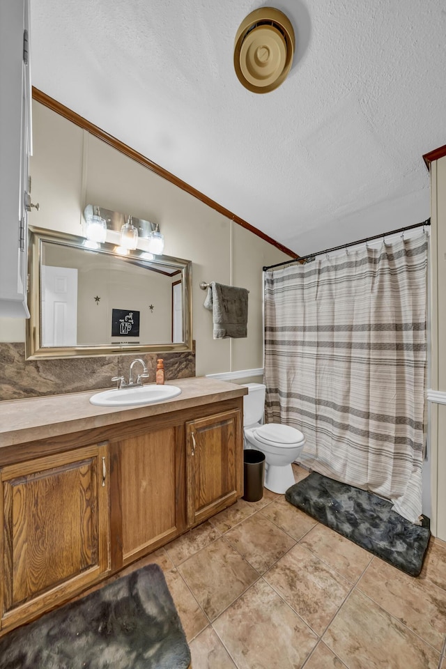 579 Fraley Rd, Salt Lick, KY 40371 - bathroom featuring toilet, a textured ceiling, vanity, lofted ceiling, and ornamental molding