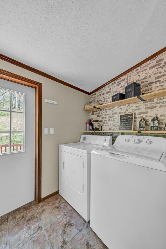 579 Fraley Rd, Salt Lick, KY 40371 - laundry area with crown molding, washer and clothes dryer, laundry area, and a textured ceiling