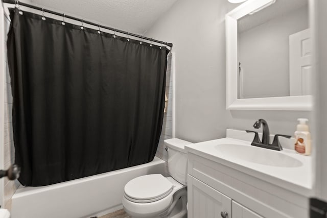 full bathroom with vanity, shower / bath combination with curtain, toilet, and a textured ceiling