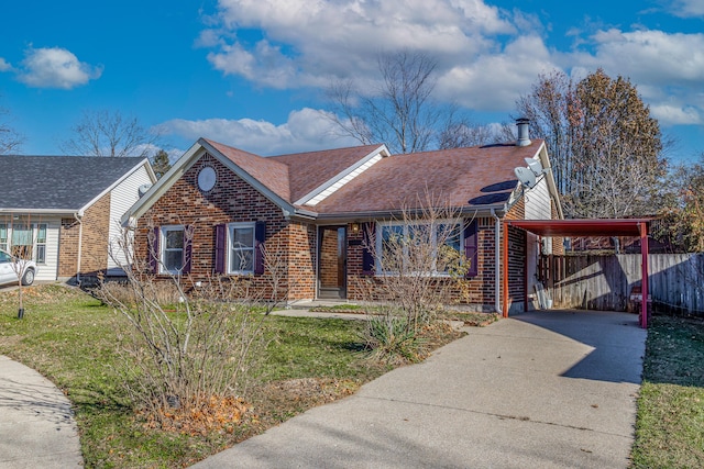 view of front of house with a front lawn and a carport