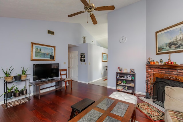 living area with visible vents, high vaulted ceiling, wood finished floors, a fireplace, and ceiling fan