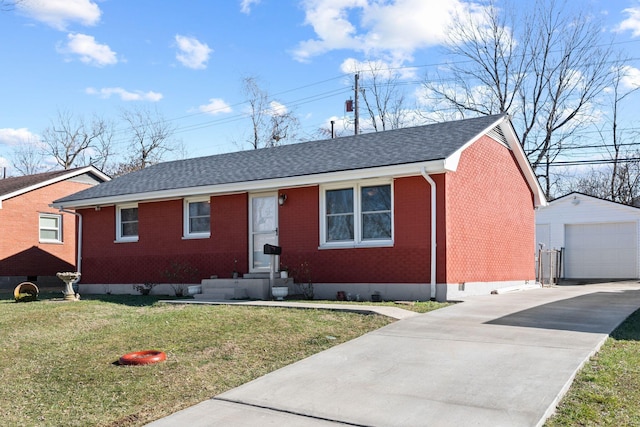 ranch-style house with an outbuilding, a garage, and a front lawn