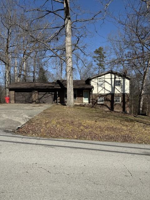 view of front of property featuring a carport