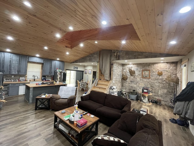 living room featuring lofted ceiling, sink, wood ceiling, and light wood-type flooring