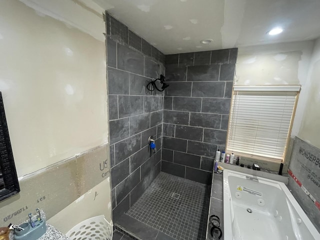 bathroom with tiled shower