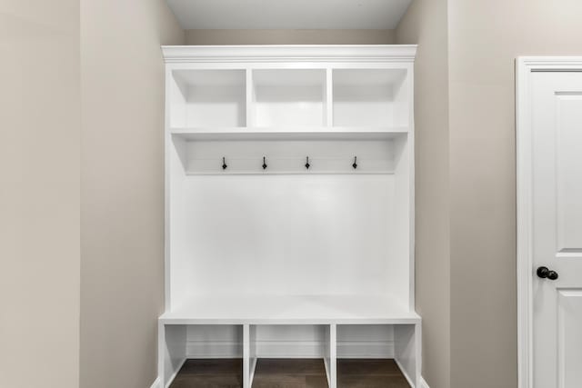 mudroom with wood finished floors and baseboards