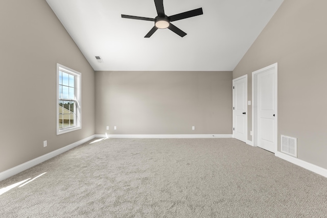 spare room with a ceiling fan, carpet flooring, visible vents, and baseboards