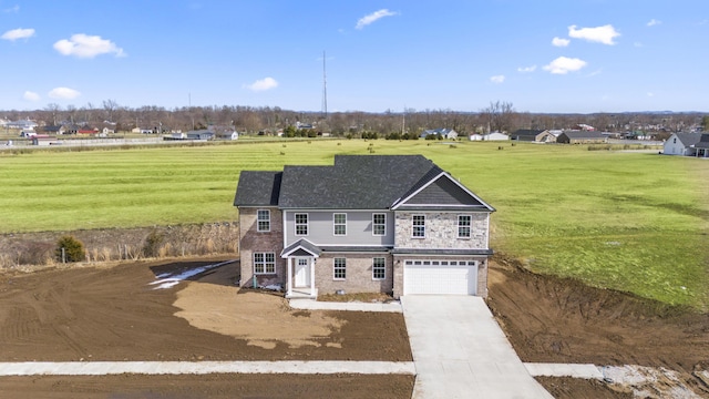 view of front of home with concrete driveway, stone siding, an attached garage, and a front yard