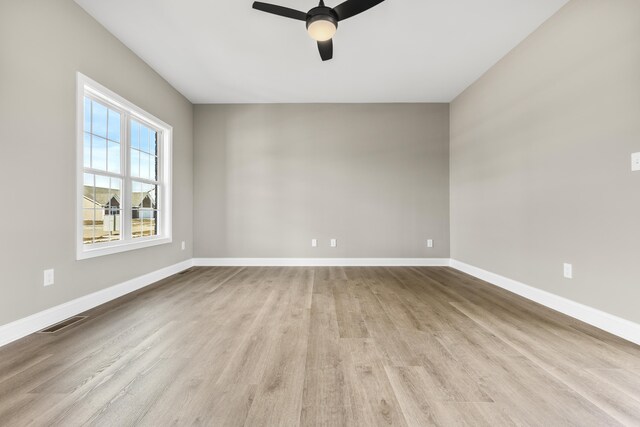 kitchen featuring appliances with stainless steel finishes, light hardwood / wood-style floors, sink, and white cabinets