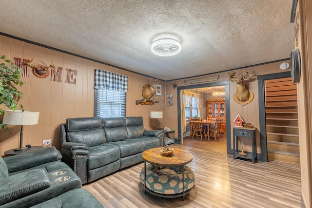 living room featuring hardwood / wood-style flooring and a textured ceiling