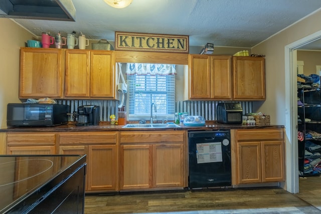 kitchen featuring dark hardwood / wood-style floors, sink, a textured ceiling, and black appliances