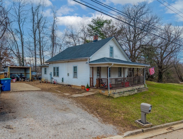 view of front of home with covered porch and a front yard