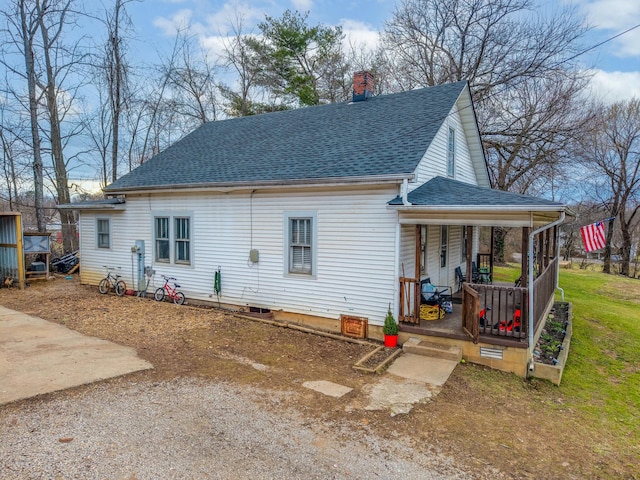 rear view of house with a porch