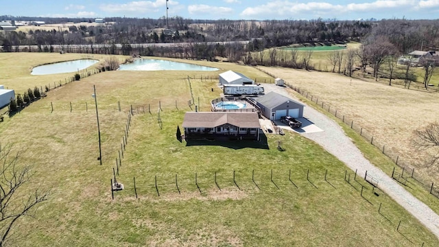 drone / aerial view featuring a water view and a rural view