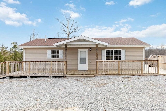 view of front of property with a wooden deck