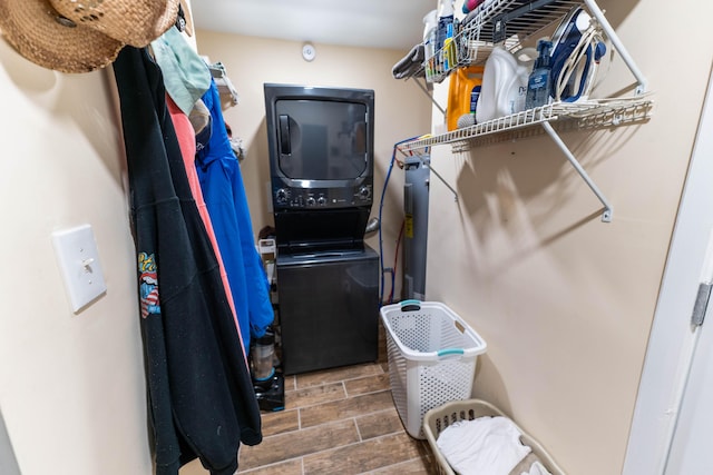 walk in closet featuring stacked washer and dryer and wood tiled floor