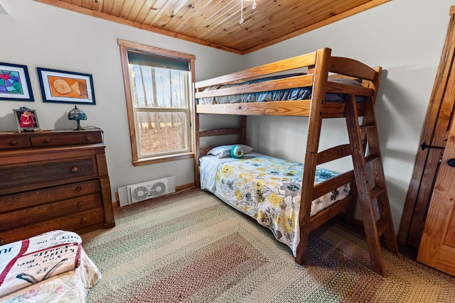 bedroom featuring carpet, visible vents, crown molding, and wooden ceiling