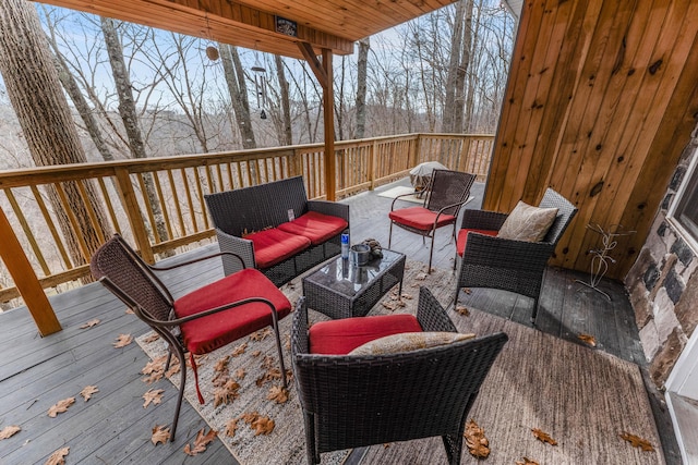 wooden deck featuring an outdoor hangout area