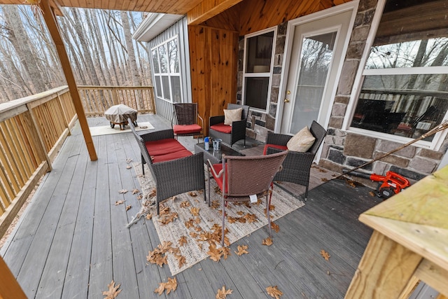 wooden deck featuring an outdoor hangout area