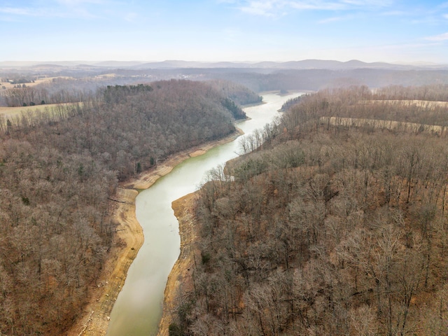 drone / aerial view featuring a water and mountain view