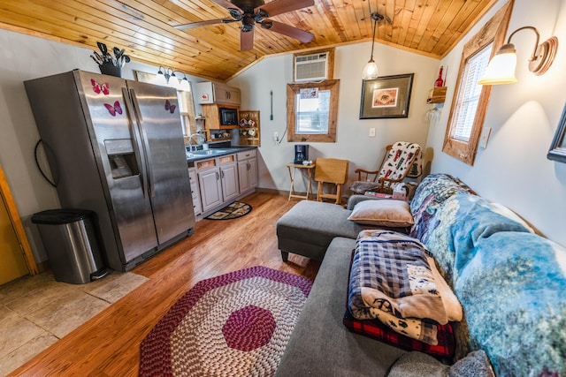 living room featuring plenty of natural light, a wall mounted AC, and wood ceiling