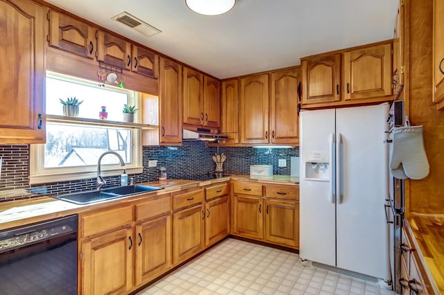 228 Jolly Ridge Rd, Richmond, KY 40475 - kitchen featuring white fridge with ice dispenser, dishwasher, a sink, and brown cabinetry