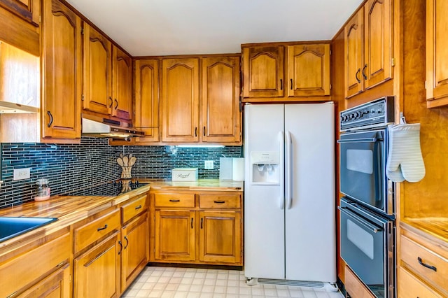 228 Jolly Ridge Rd, Richmond, KY 40475 - kitchen featuring black appliances, brown cabinets, decorative backsplash, and light floors