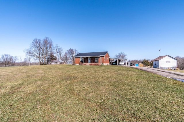 228 Jolly Ridge Rd, Richmond, KY 40475 - view of front of home featuring asphalt driveway, a front lawn, and a carport