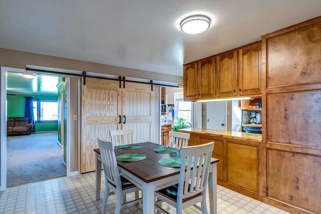 228 Jolly Ridge Rd, Richmond, KY 40475 - dining room with a barn door, light floors, and light carpet