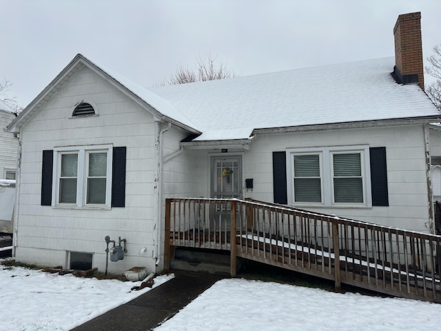 view of snow covered property entrance