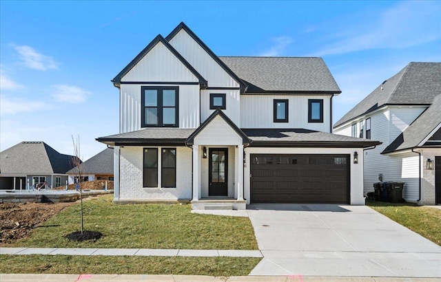 modern farmhouse style home with a garage and a front lawn