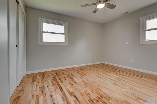 empty room featuring ceiling fan and light wood-type flooring