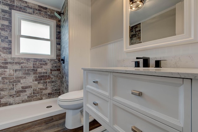 bathroom with vanity, walk in shower, and toilet