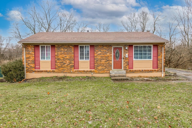 single story home featuring a front lawn