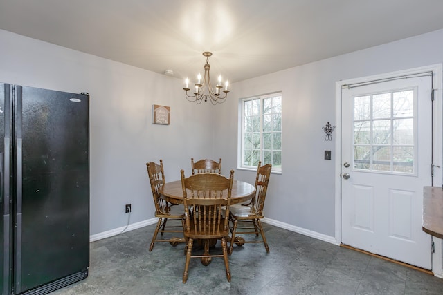 dining area featuring an inviting chandelier