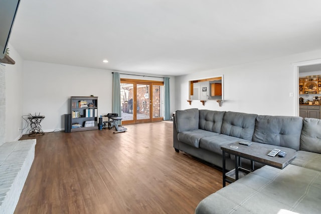 living room with hardwood / wood-style floors and french doors