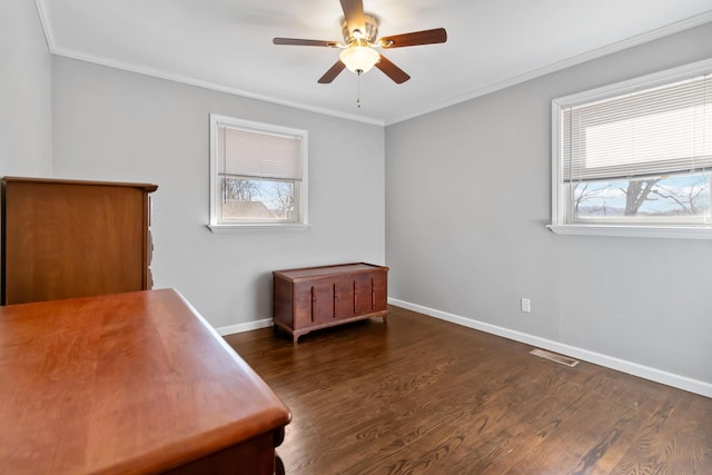 bedroom with ornamental molding, dark hardwood / wood-style floors, and ceiling fan