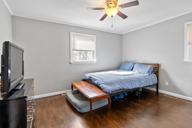 bedroom with dark hardwood / wood-style flooring, ornamental molding, and ceiling fan