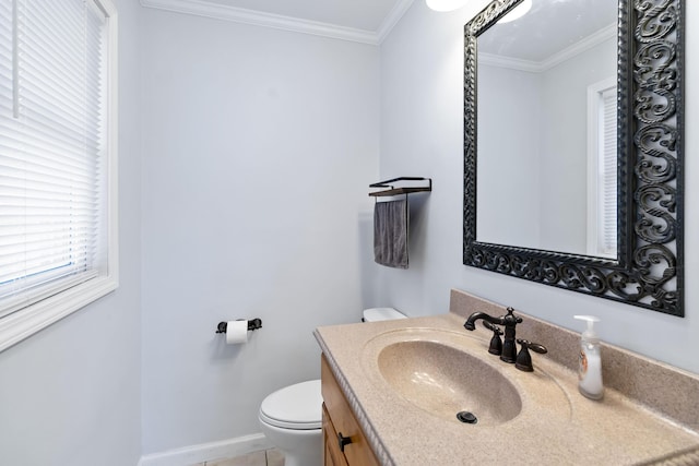 bathroom featuring vanity, ornamental molding, and toilet