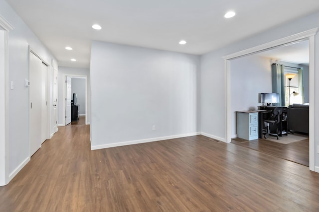 spare room featuring dark hardwood / wood-style flooring