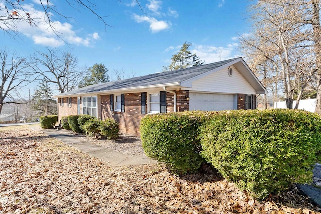 single story home featuring a garage