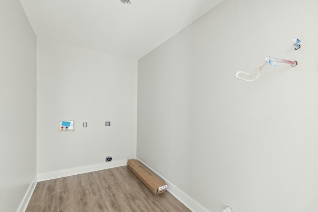 laundry room with gas dryer hookup, washer hookup, and light wood-type flooring