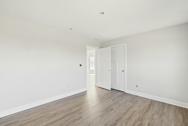 empty room with light wood-type flooring