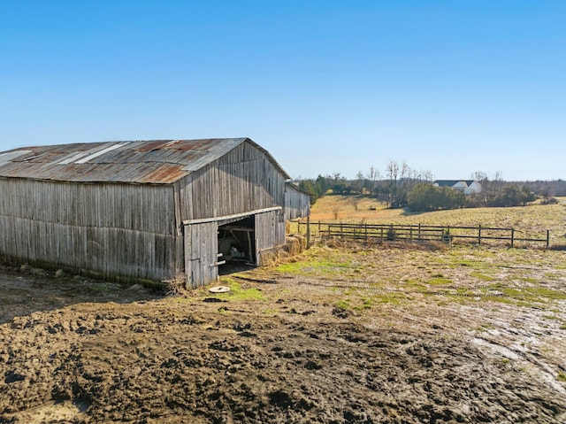 view of outbuilding featuring a rural view