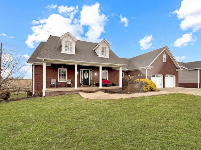 cape cod-style house with a porch, a garage, and a front yard