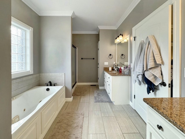 bathroom with independent shower and bath, vanity, and ornamental molding