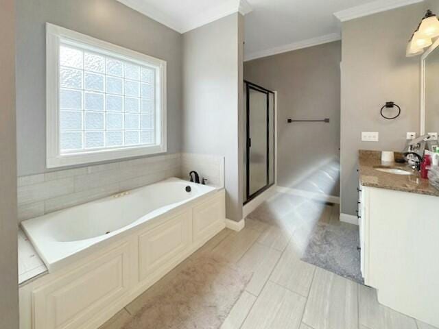 bathroom with vanity, crown molding, and plus walk in shower