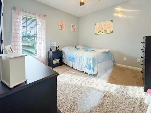 bedroom with ceiling fan and carpet flooring