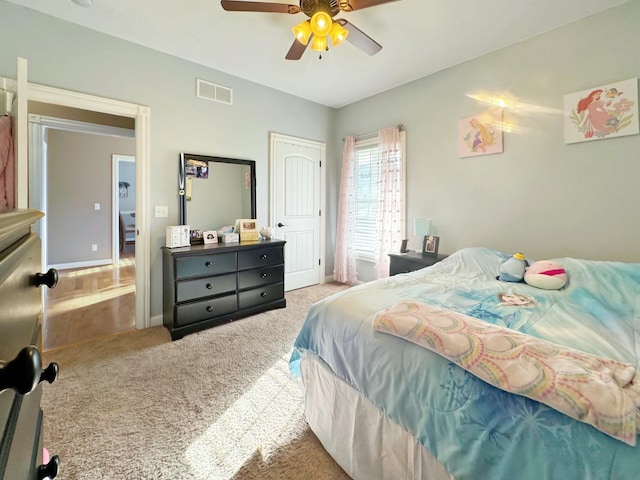 carpeted bedroom with ceiling fan